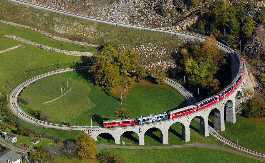 Train on the Brusio circular viaduct in Switzerland