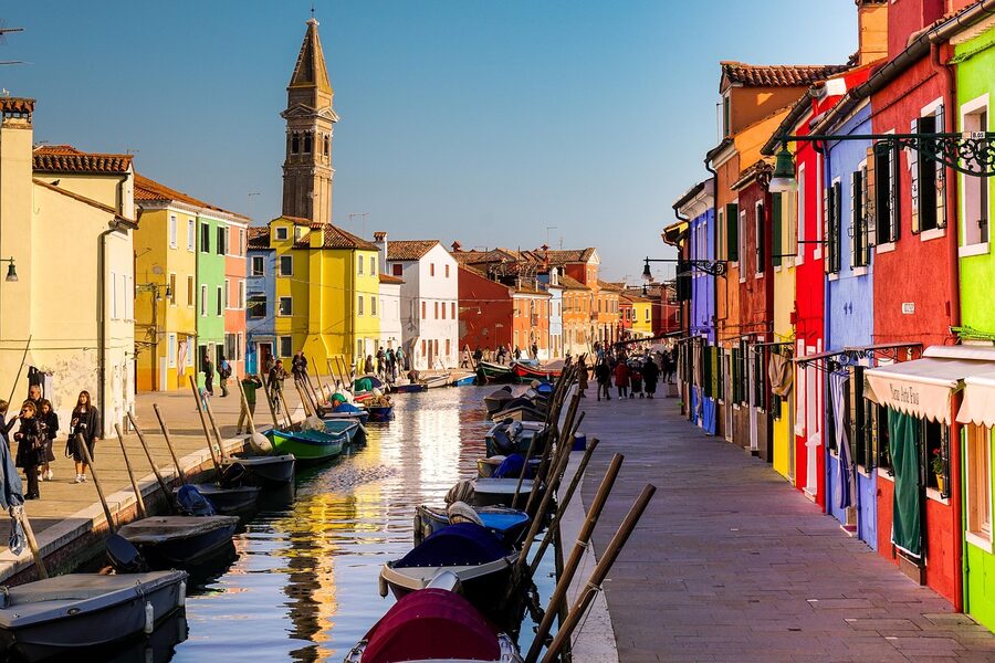 Burano channel with rows of colorful houses lining the water