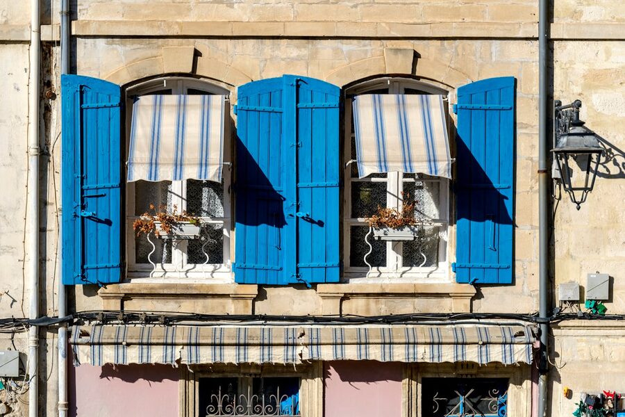 Provence window with blue shutters in Arles