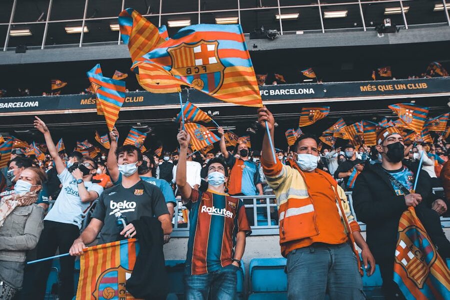 FC Barcelona fans waving flags at a match