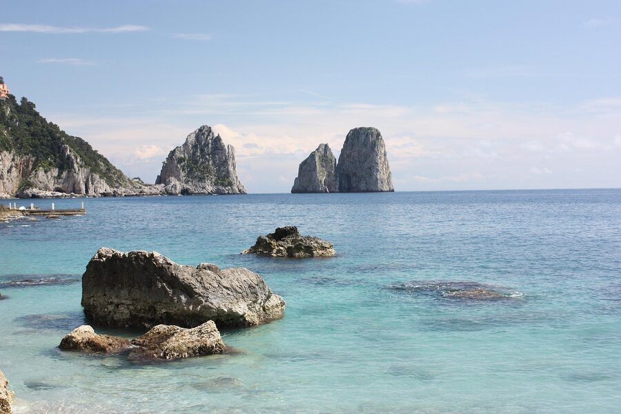 Capri sea stacks on the horizon viewed from a boat