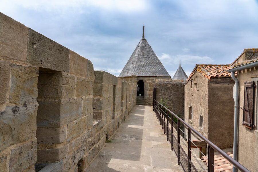 Stone pathway leading to conical-roofed towers at Carcassonne