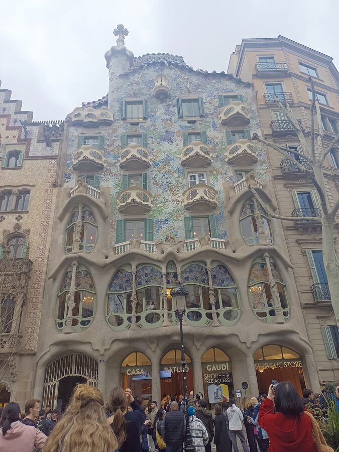 Casa Batllo facade next to Casa Amatller on Passeig de Gracia