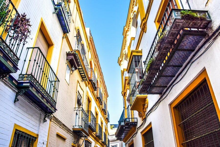 Narrow street in Seville old town near Casa de Pilatos