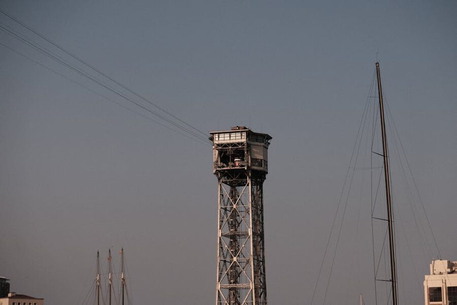 Barcelona Port cable tower with sailboat mast