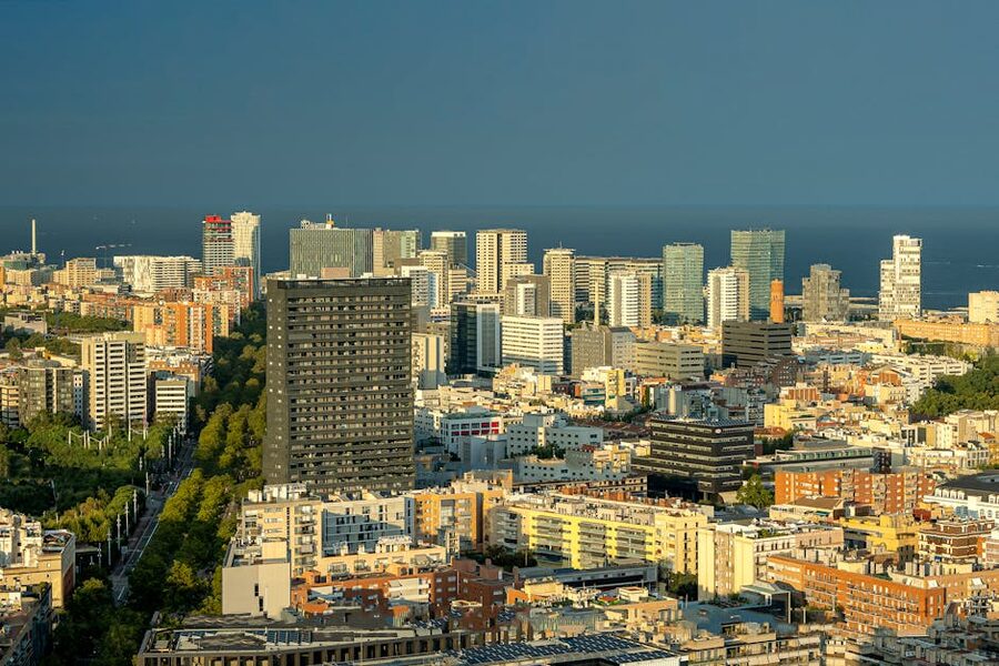 Barcelona skyline meeting Mediterranean Sea at sunset