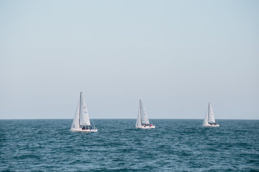 Three sailboats off the Barcelona coast on the Mediterranean