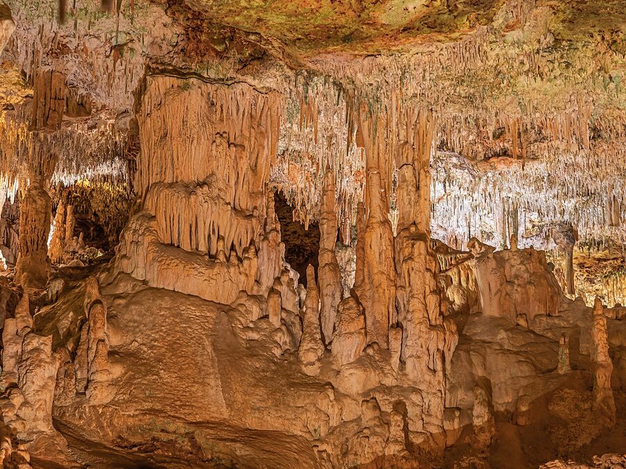 Cave passage with visitors at Coves dels Hams