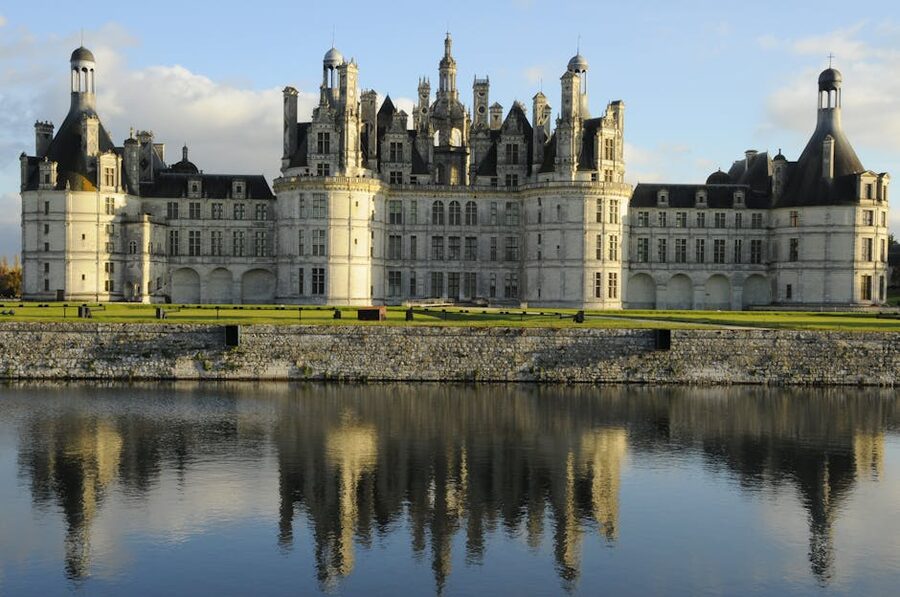 Chambord castle reflected in the canal in front
