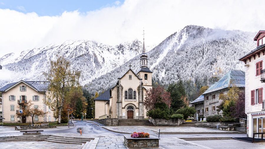 Chamonix church with snowy Alps behind, French Alps