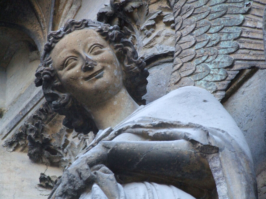 Smiling angel sculpture at Reims cathedral north portal