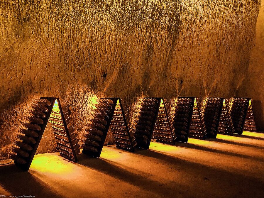 Ruinart crayeres chalk cellar with riddling racks of aging champagne