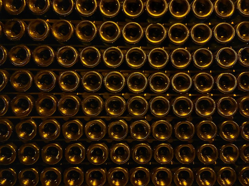 Stacked champagne bottles aging in dimly lit cellar