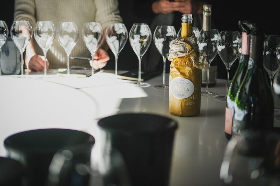 Champagne tasting setup with multiple glasses and bottles in Ay
