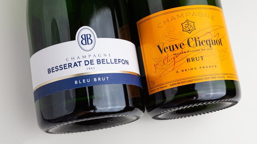 Veuve Clicquot and Besserat de Bellefon champagne bottles closeup