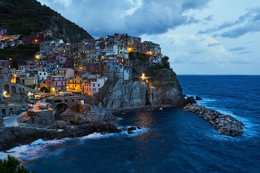 Manarola at blue hour with lights in the windows Cinque Terre
