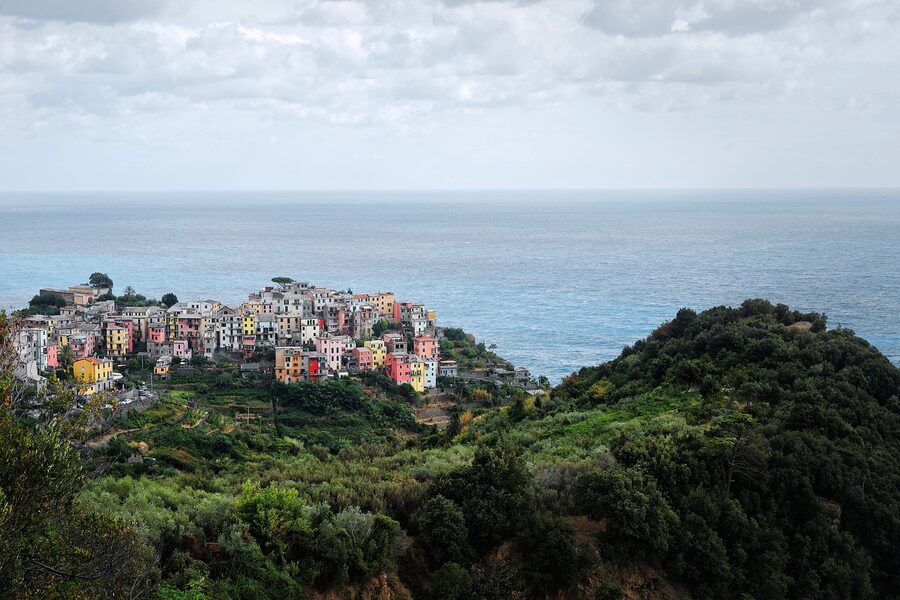 Cinque Terre seaside village with mountains rising behind