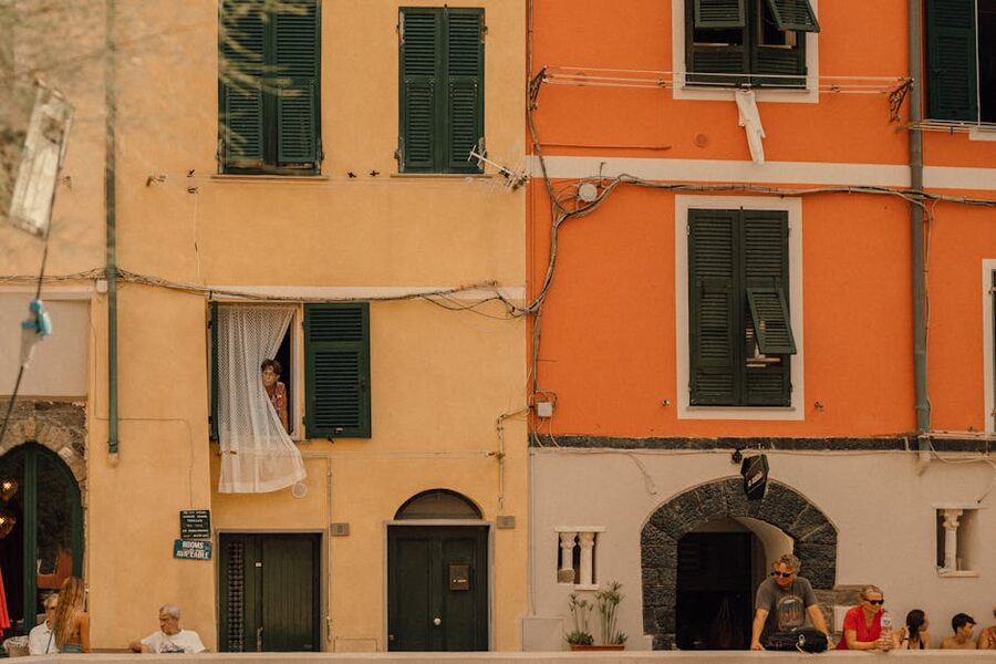 Street scene in Vernazza Cinque Terre with restaurants and lemon trees