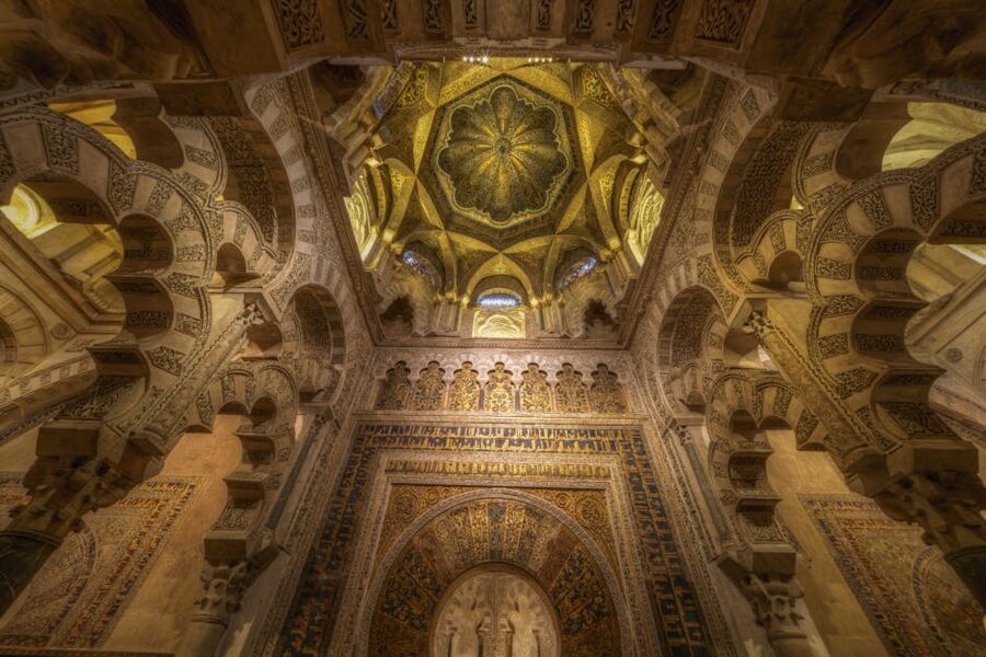 Interior arches and decor inside the Mosque-Cathedral of Cordoba