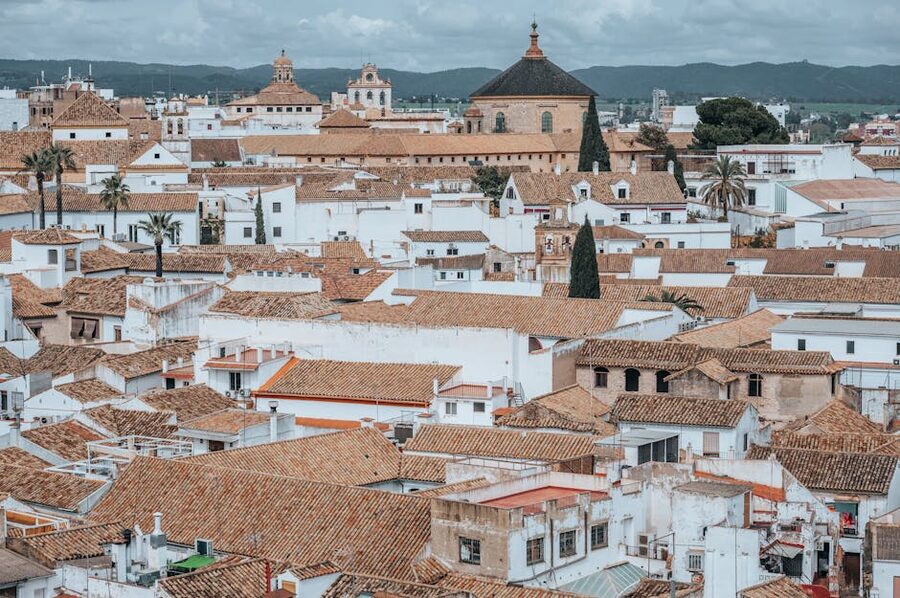 Aerial view of the white rooftops of Cordoba with the Mezquita rising above