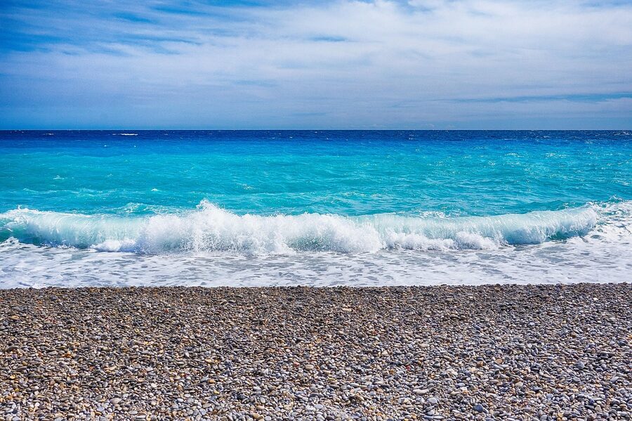 Mediterranean waves crashing on rocky Cote d'Azur shore