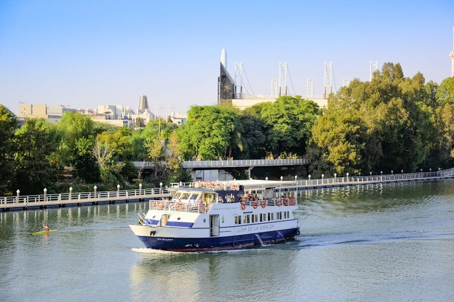 A cruise boat sailing on the Guadalquivir River