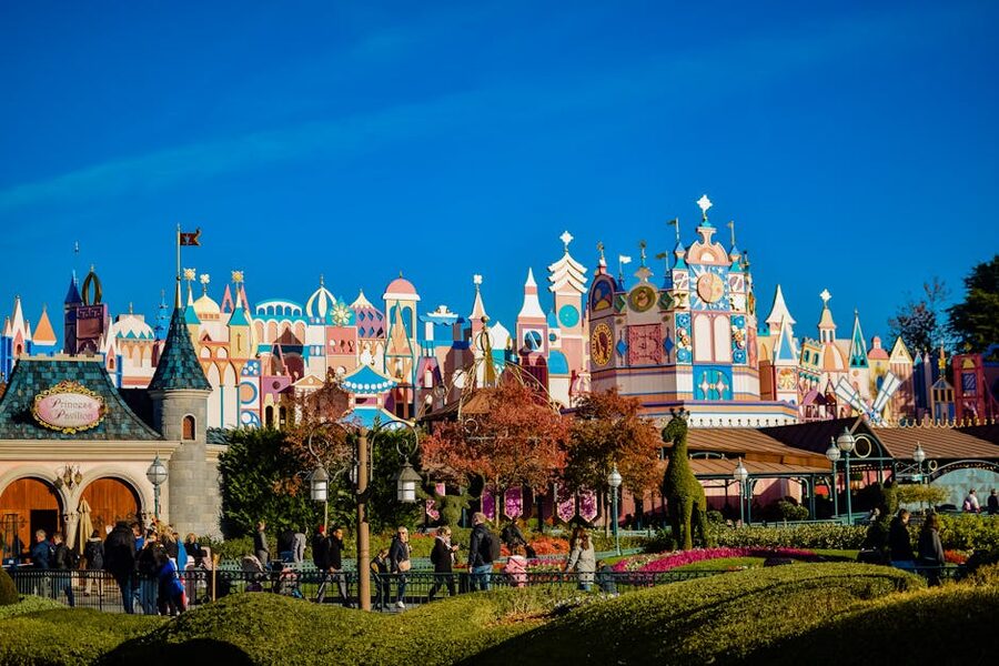 Disneyland Paris architecture and visitors clear blue sky