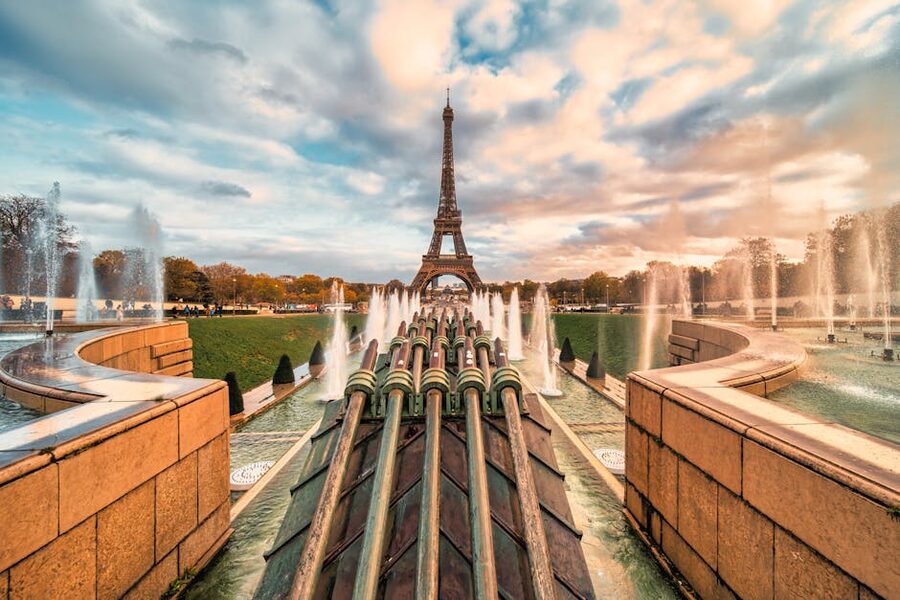 Eiffel Tower with fountains at sunset in Paris