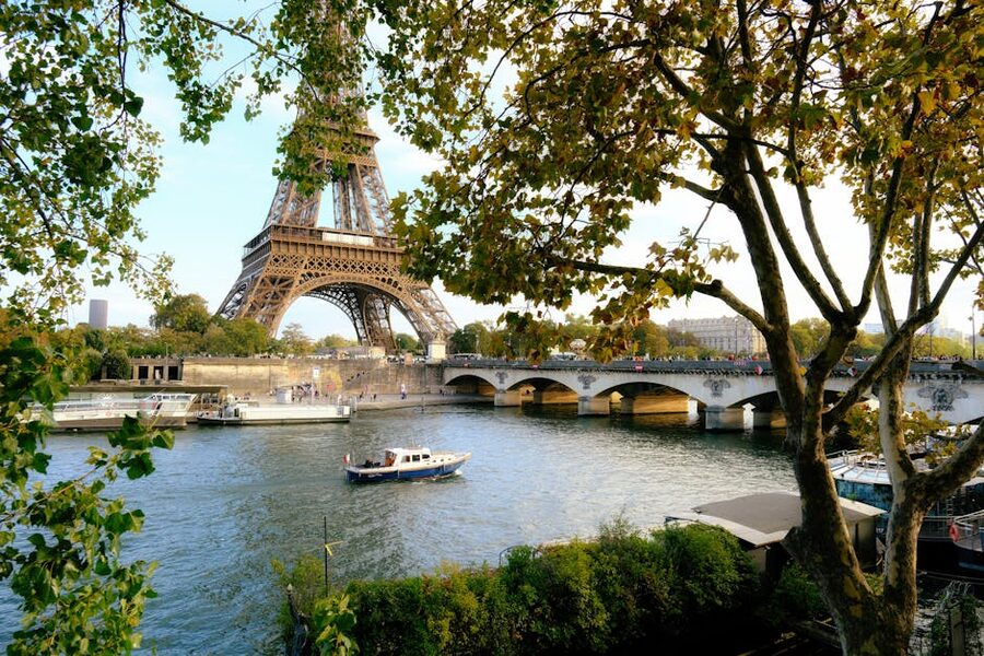 Eiffel Tower over Seine River with trees
