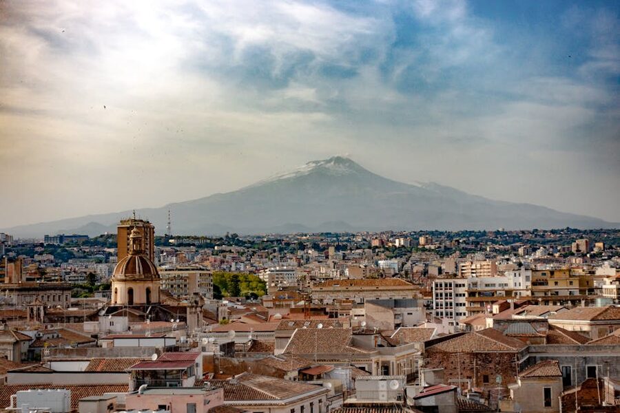 Catania cityscape with Mount Etna in the distance
