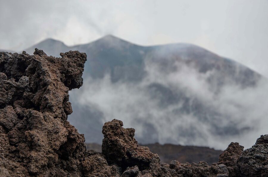 Cooled lava flow on Mount Etna with active fissure visible