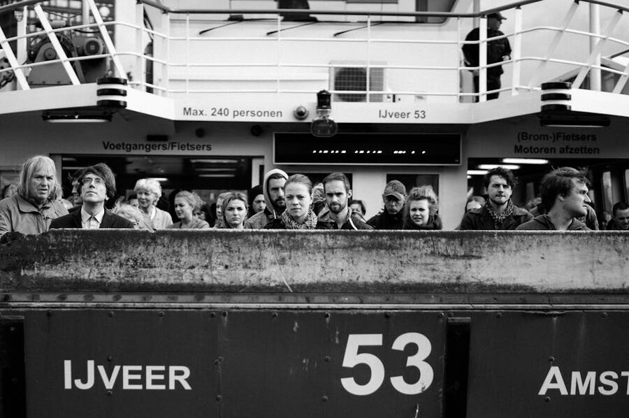 Passengers on the free IJ ferry crossing in Amsterdam