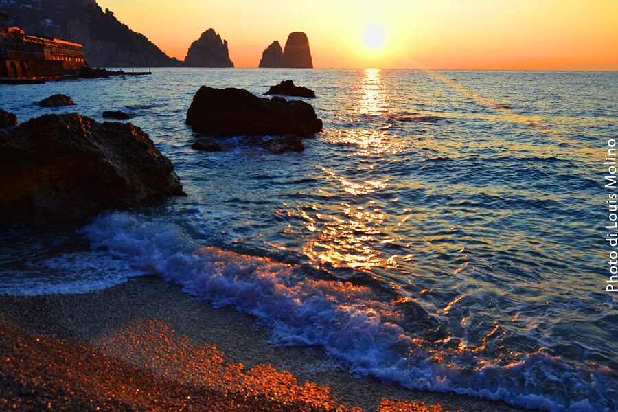 Faraglioni di Capri at dawn with pink sky