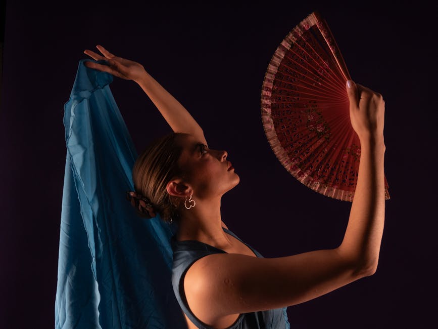 Flamenco dancer with traditional fan posing