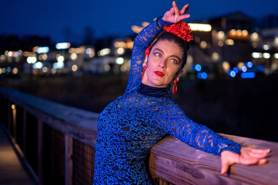 A solo flamenco dancer at night in a quiet Spanish setting