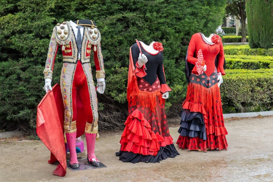 Traditional flamenco dresses on display in a Madrid shop window