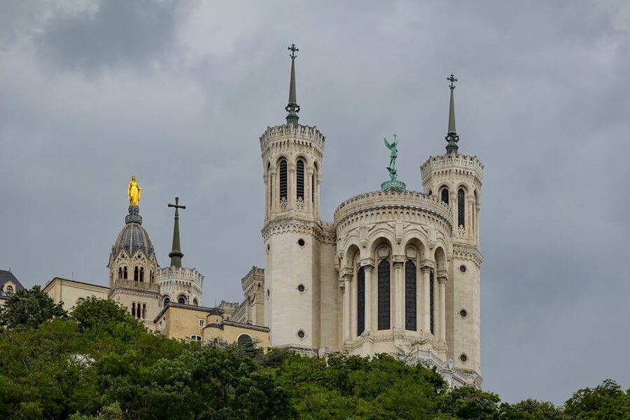 Notre-Dame de Fourviere basilica with golden statue of Mary on top, Lyon