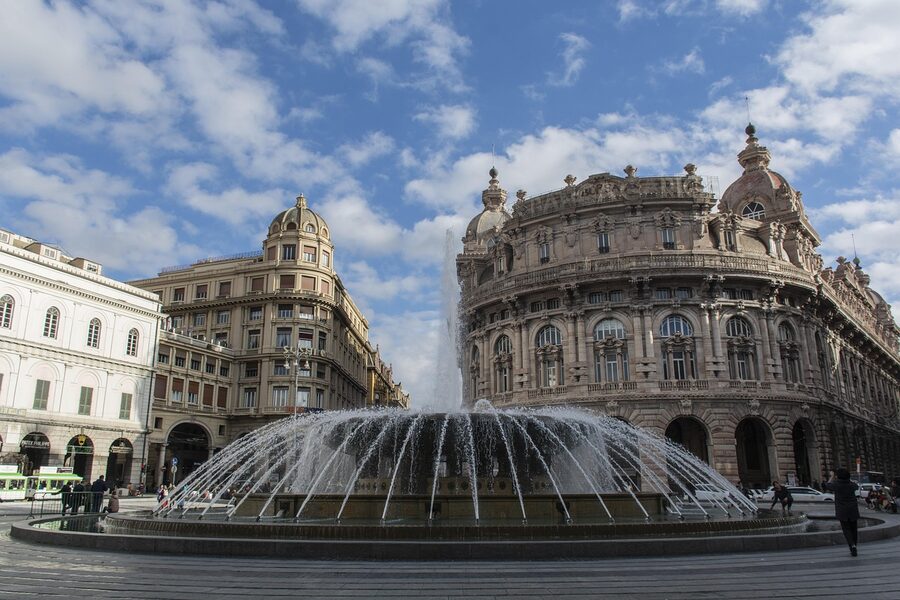 Genoa fountain and historic palazzo facade in the old town