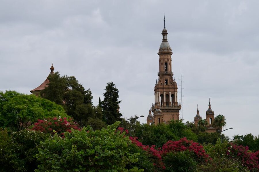 La Giralda tower with gardens and flowers in Seville