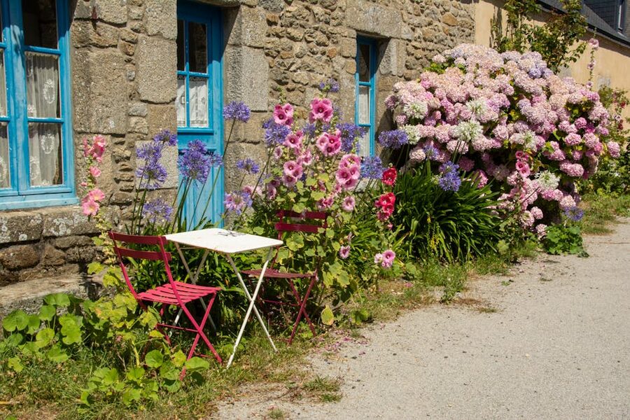 Stone cottage with bistro seating in a French village