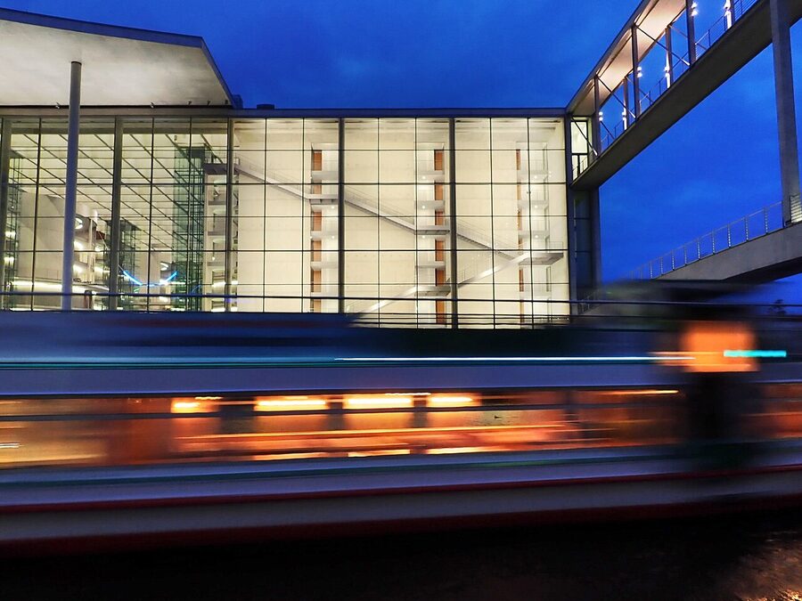 Berlin government complex with a river boat passing on the Spree