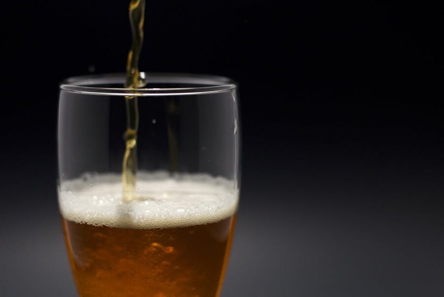 Foamy beer pour close up