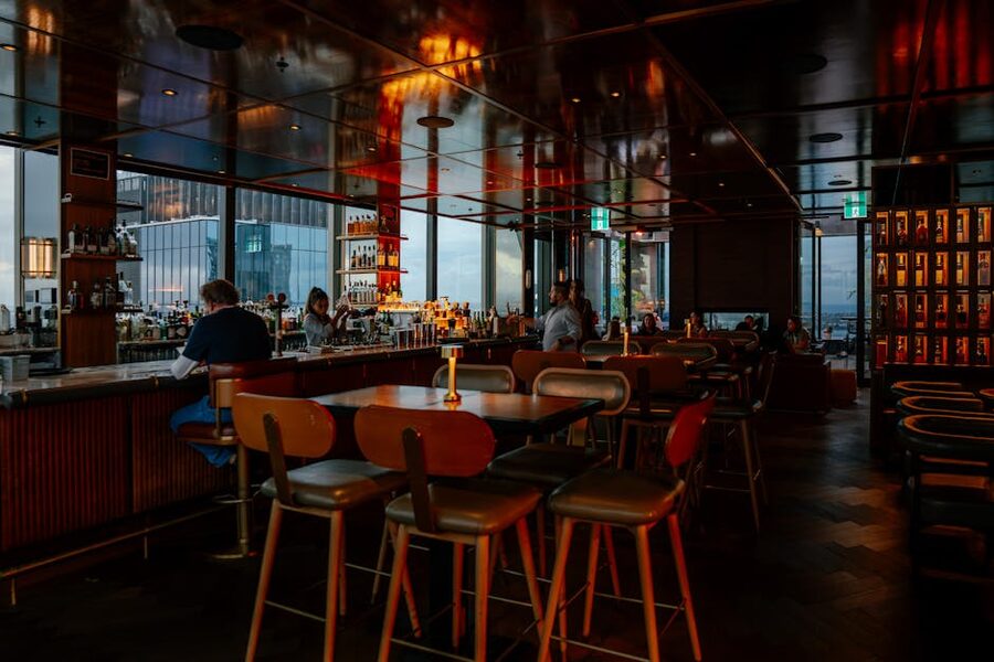 Cozy rooftop bar with patrons and city view