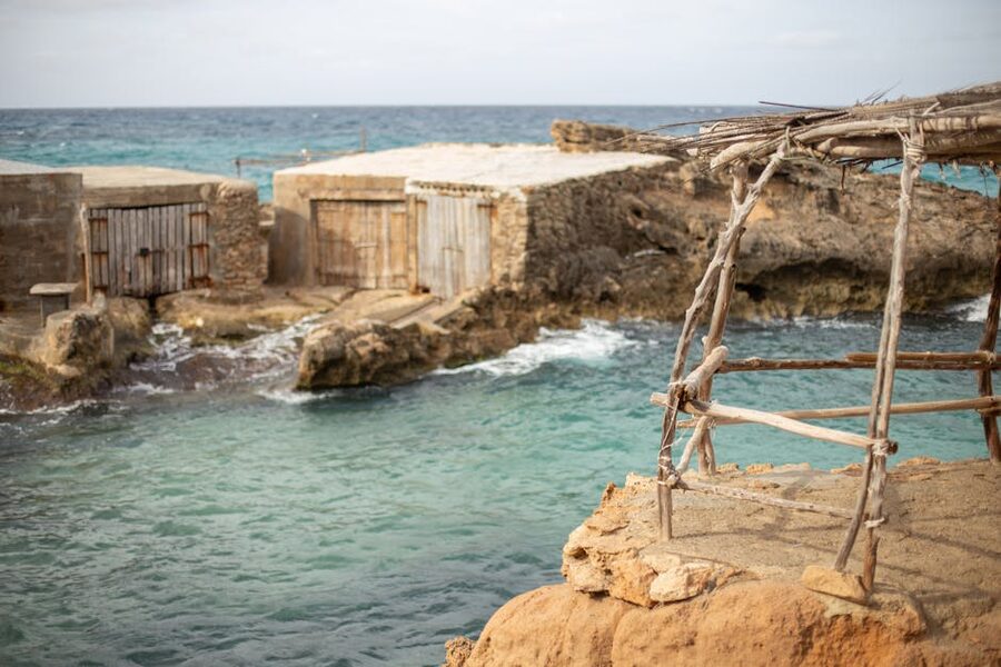 Ibiza rugged coastline with rocky shores and turquoise waters