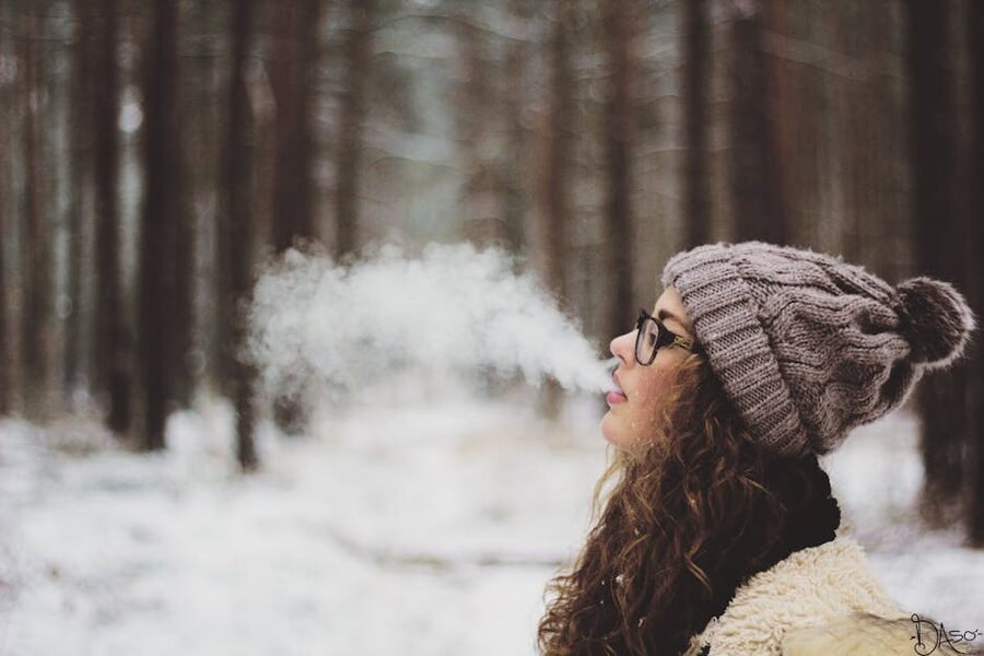 Visible breath in cold air showing condensation in winter
