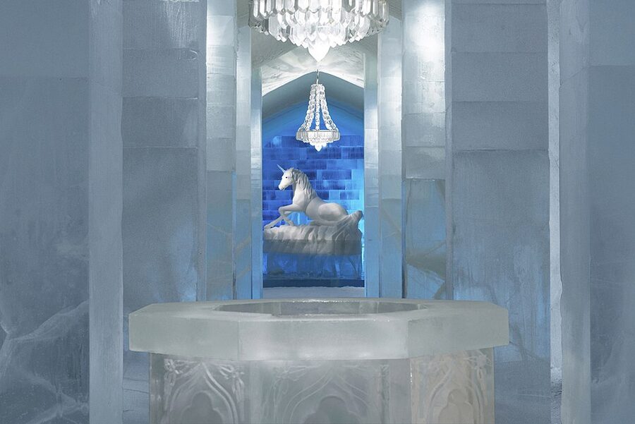 ICEHOTEL Sweden main hall with carved ice arches and benches