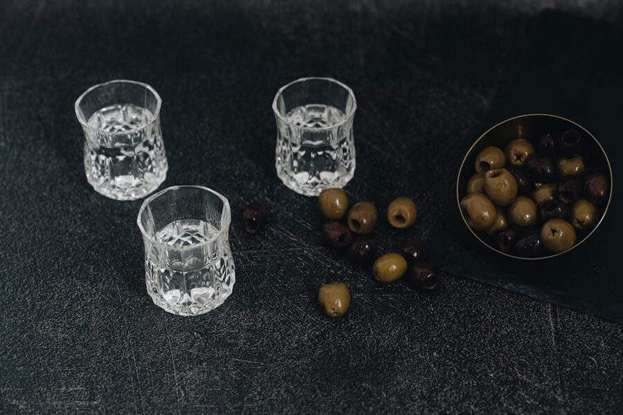 Crystal glasses filled with chilled vodka shots ready to drink