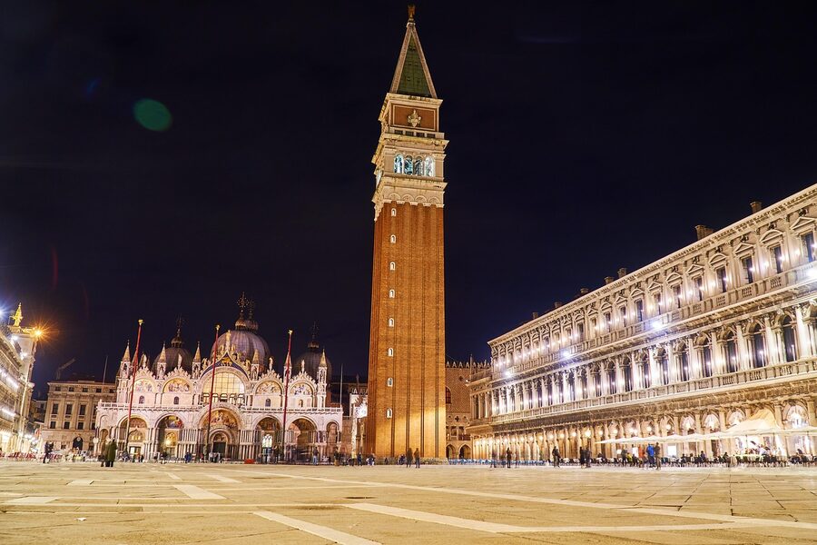 Piazza San Marco at night with basilica lit up