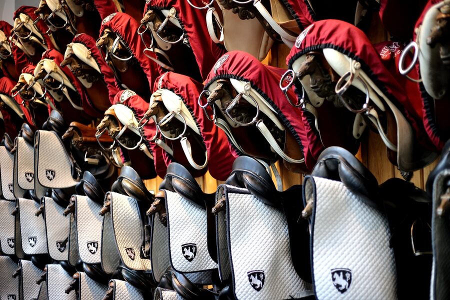 A Spanish tack room with traditional saddles and bridles