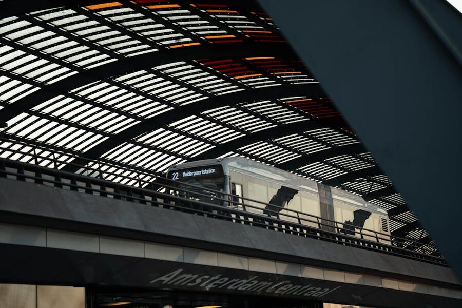 Train at Amsterdam Centraal Station under the modern roof